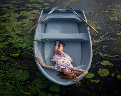 Woman relaxing in a hammock with eyes closed